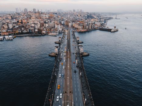Stunning aerial photo of Galata Bridge connecting vibrant districts with a sweeping view of Istanbul's skyline.