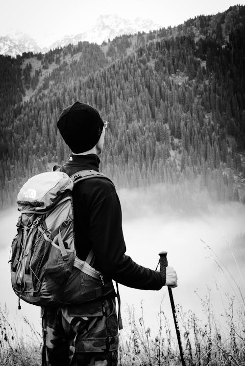 Man with Backpack and Fog behind