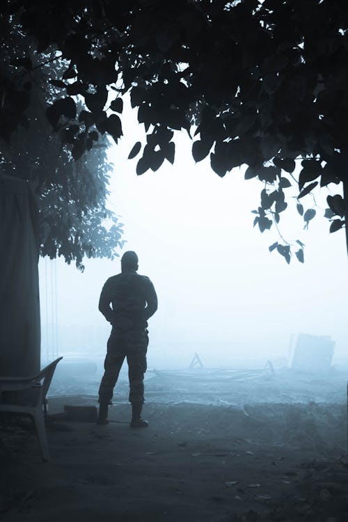 Free Man Standing in Front of a Dense Fog Stock Photo