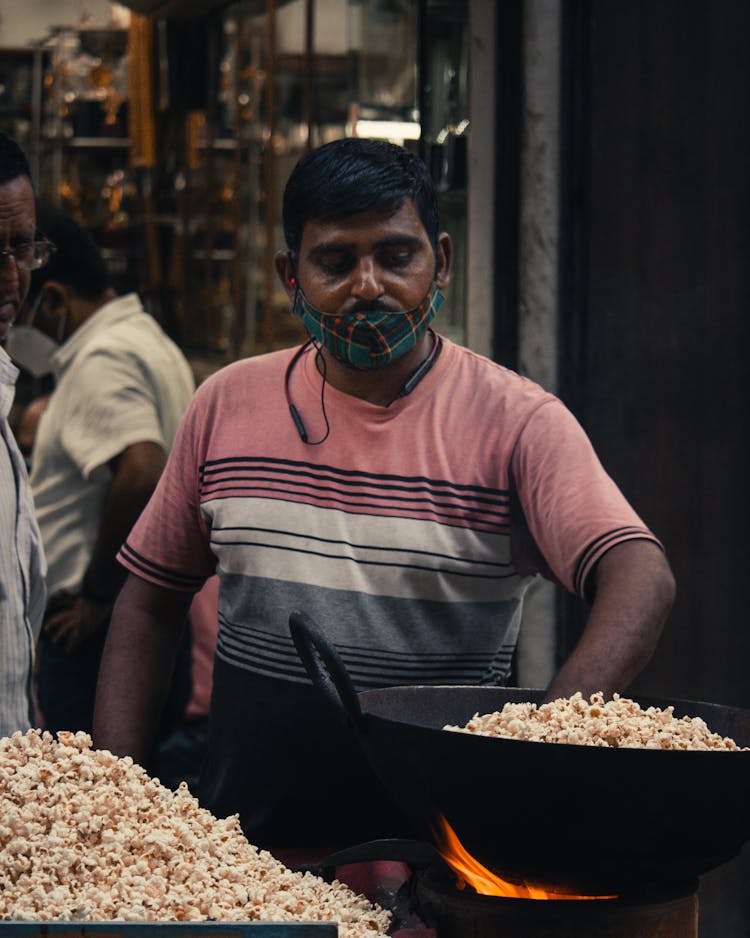 Photo Of A Man Cooking Popcorn