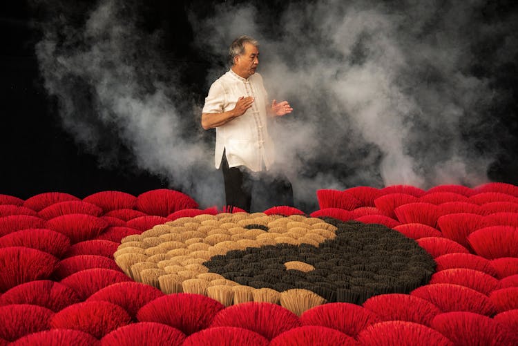 Man Praying Over Yin Yang Symbol 