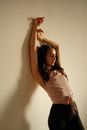 Woman Leaning against a Wall 