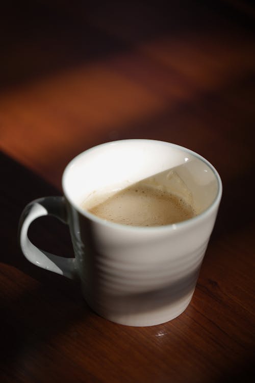 White Ceramic Mug With Brown Liquid