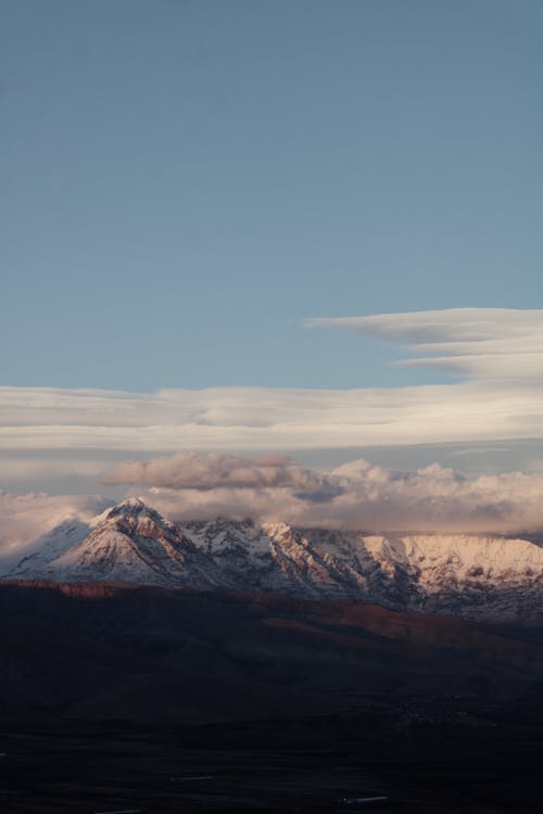 White Clouds Under the Snow Capped Mountains 