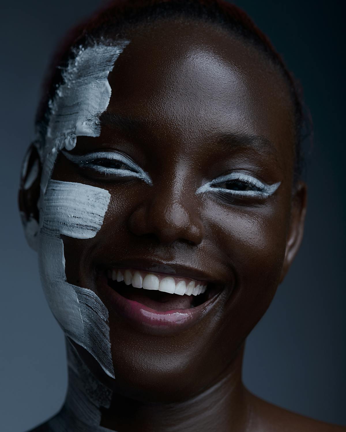 Laughing Woman with White Paint on Her Face · Free Stock Photo