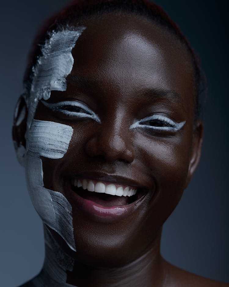 Laughing Woman With White Paint On Her Face