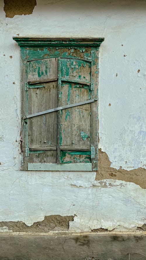 Green Wooden Window on White Concrete Wall