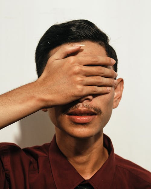 Free Man Covering His Eyes Stock Photo
