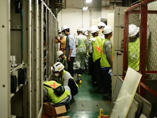 Construction Workers Working Together in a Room