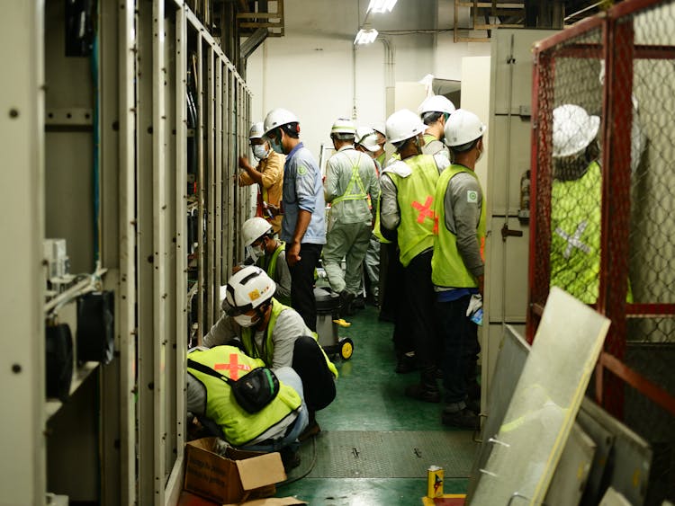 Construction Workers Working Together In A Room