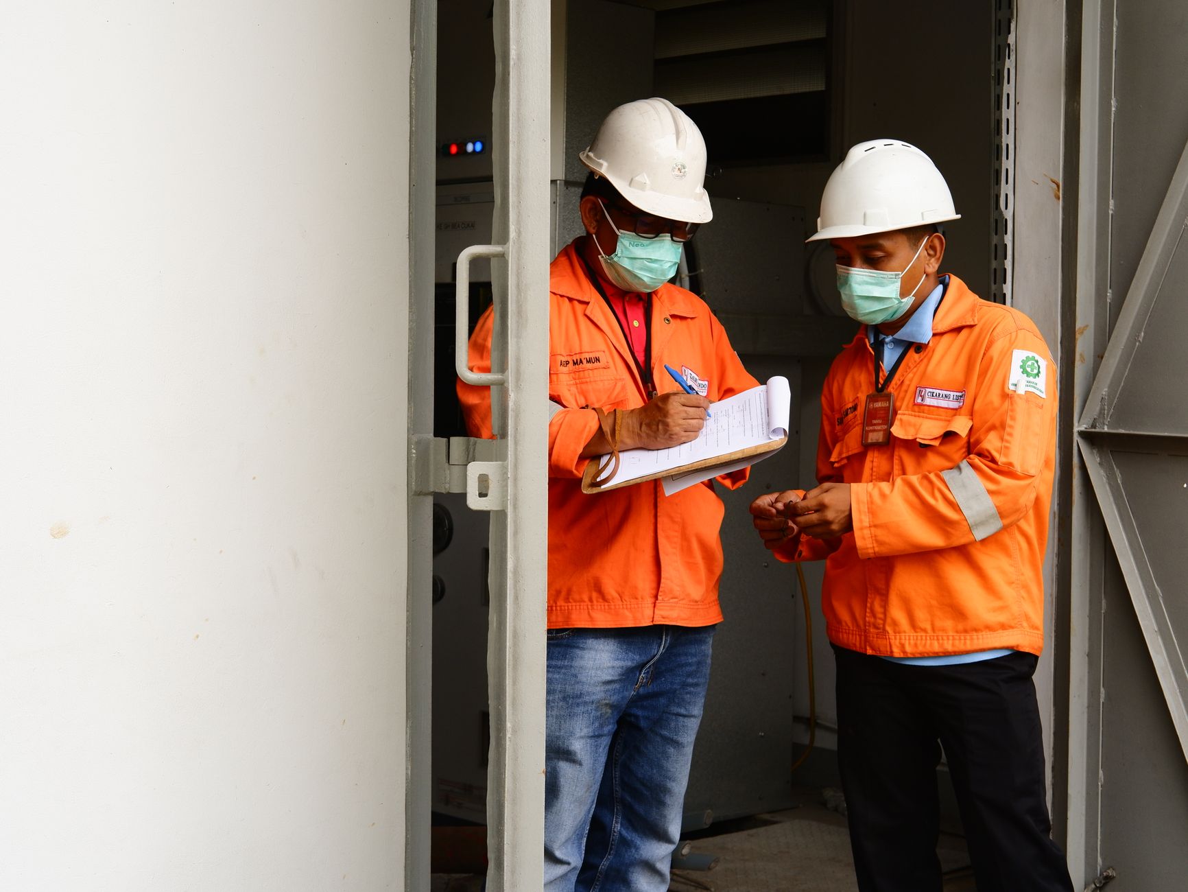 A regulatory inspection team reviewing animal welfare records inside a licensed arena office