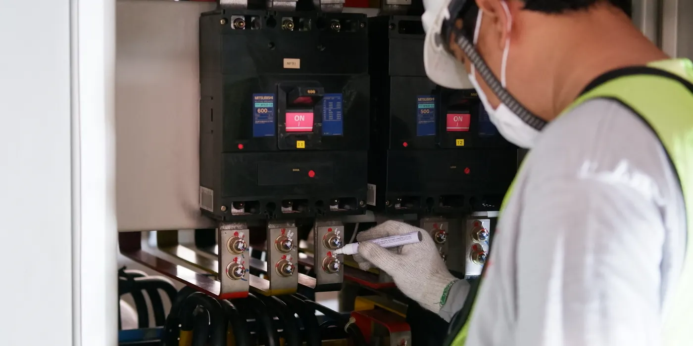 Technician inspecting installed equipment on site