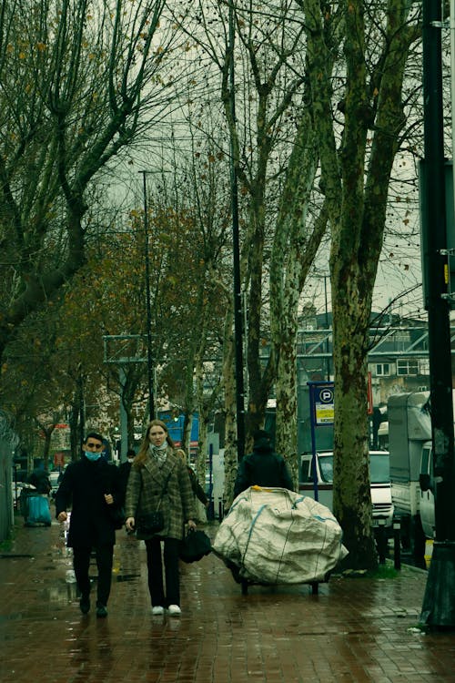 People Walking on the Sidewalk