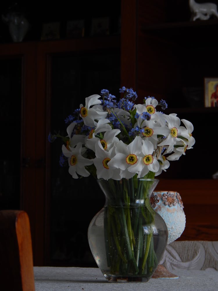 Photo Of A Glass Vase With White Narcissus Flowers