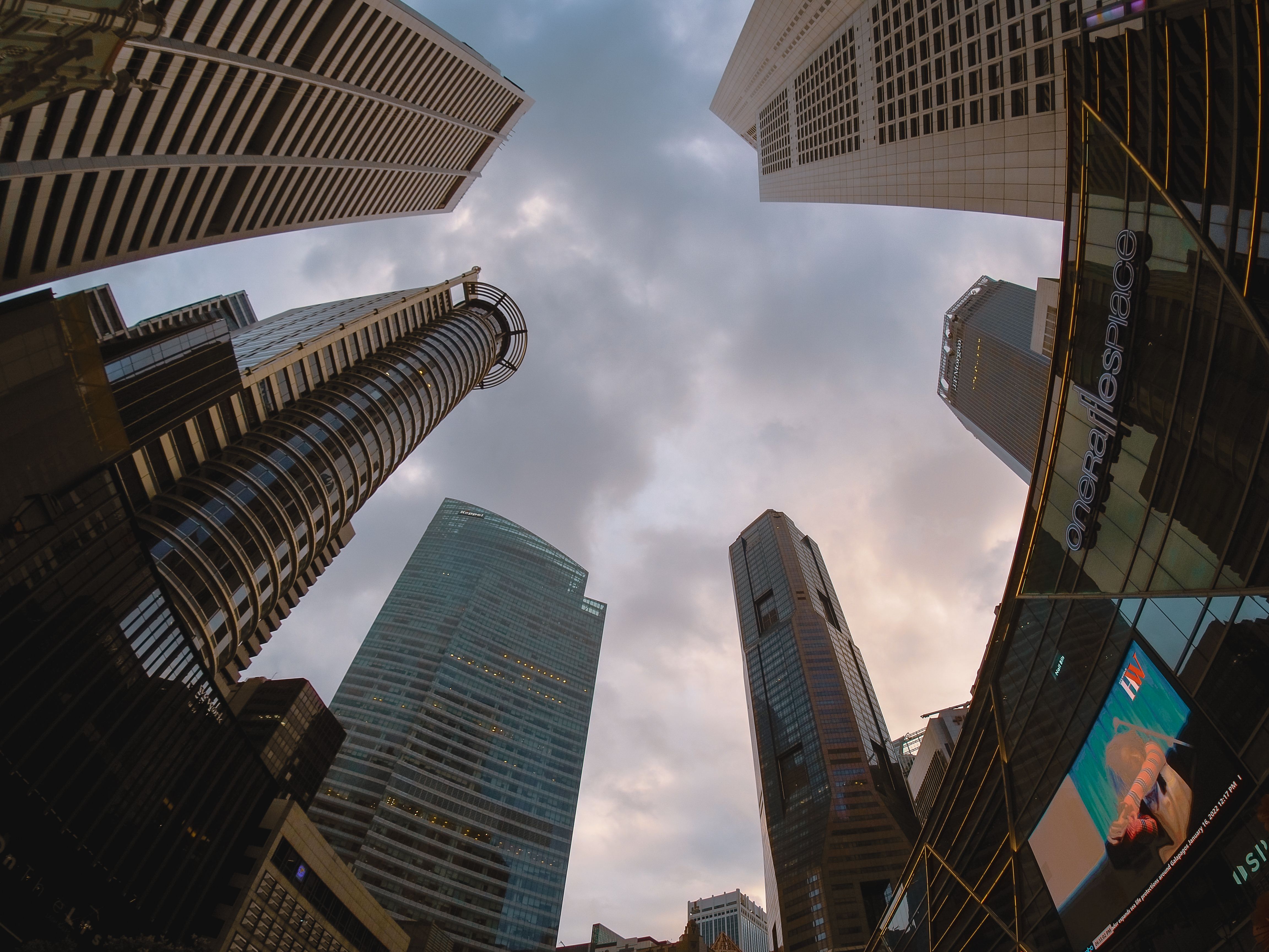 Low Angle Shot of High-Rise Buildings Under the Cloudy Sky · Free Stock ...
