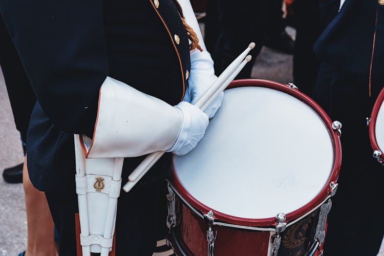 Hands Holding Drumsticks And Drum