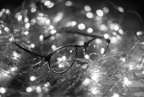 Grayscale Photo of Black Framed Eyeglasses