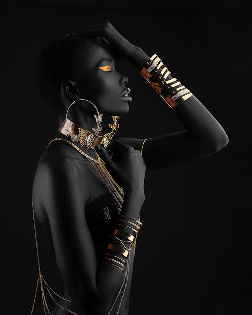 Side View of a Woman Wearing Gold Accessories
