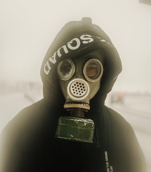 Free Person Wearing Gas Mask and Gas Mask Stock Photo