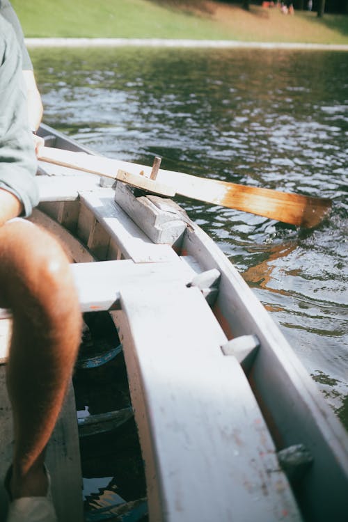 Free Person Sitting on a Rowboat Stock Photo