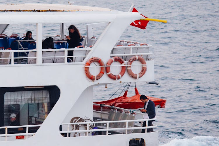 People On Ferry With Turkish Flag