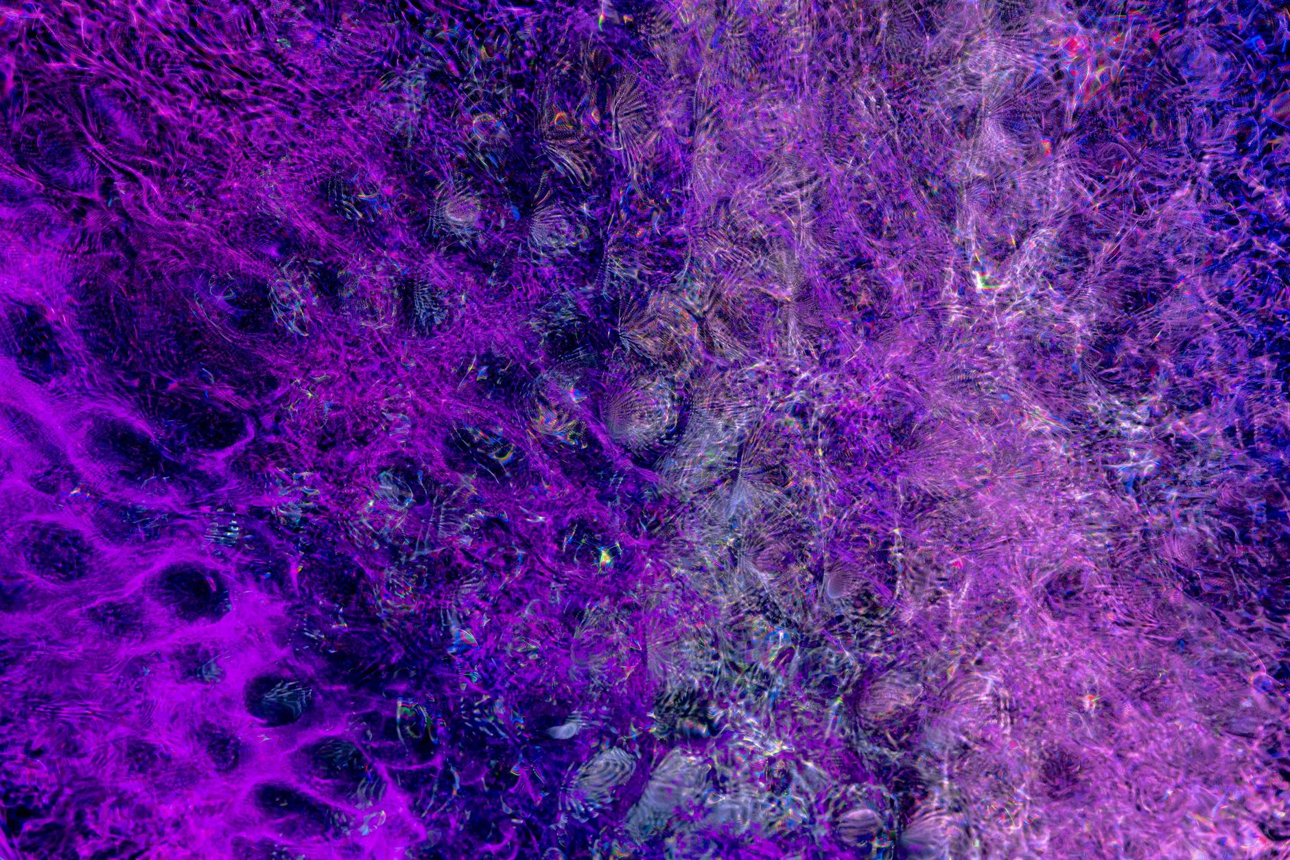A mesmerizing abstract background with vibrant purple hues and intricate textures.
