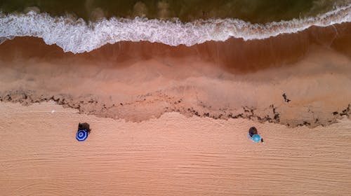 Drone Shot of Umbrellas on the Sand