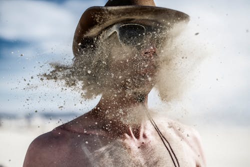 Free Man with Sand on Face Stock Photo