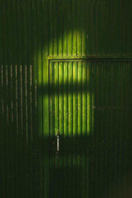 Close Up Photo of a Green Metal Gate