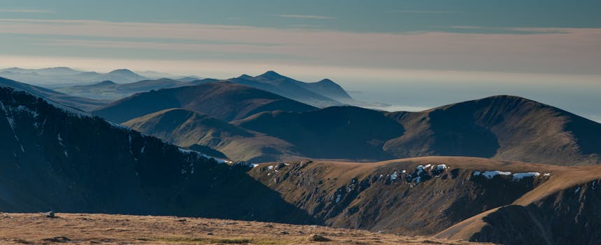 Stunning view of the Snowdonia mountains in Wales showcasing sweeping vistas and natural beauty.