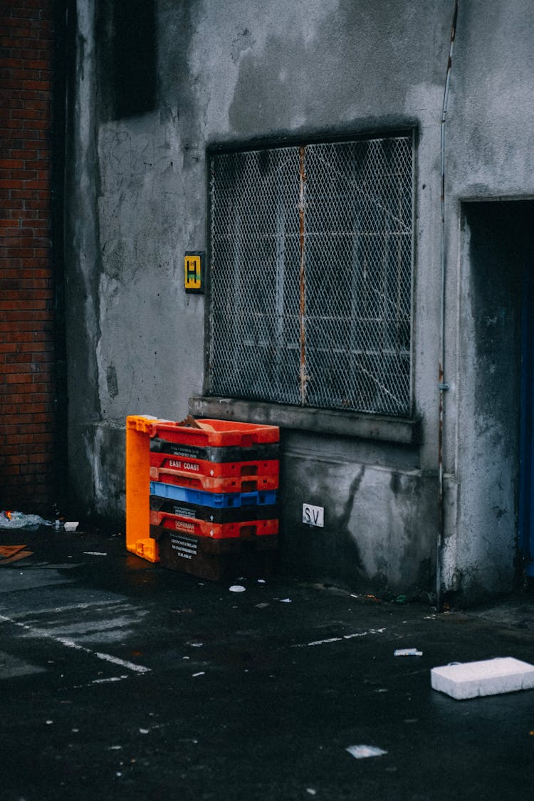 Crates Beside Gray Steel Grills