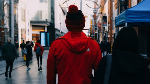 Back View of Two People Walking Together on the Street