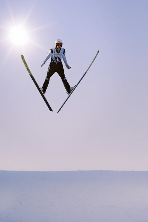 Free Ski Jumper and the Sun Stock Photo