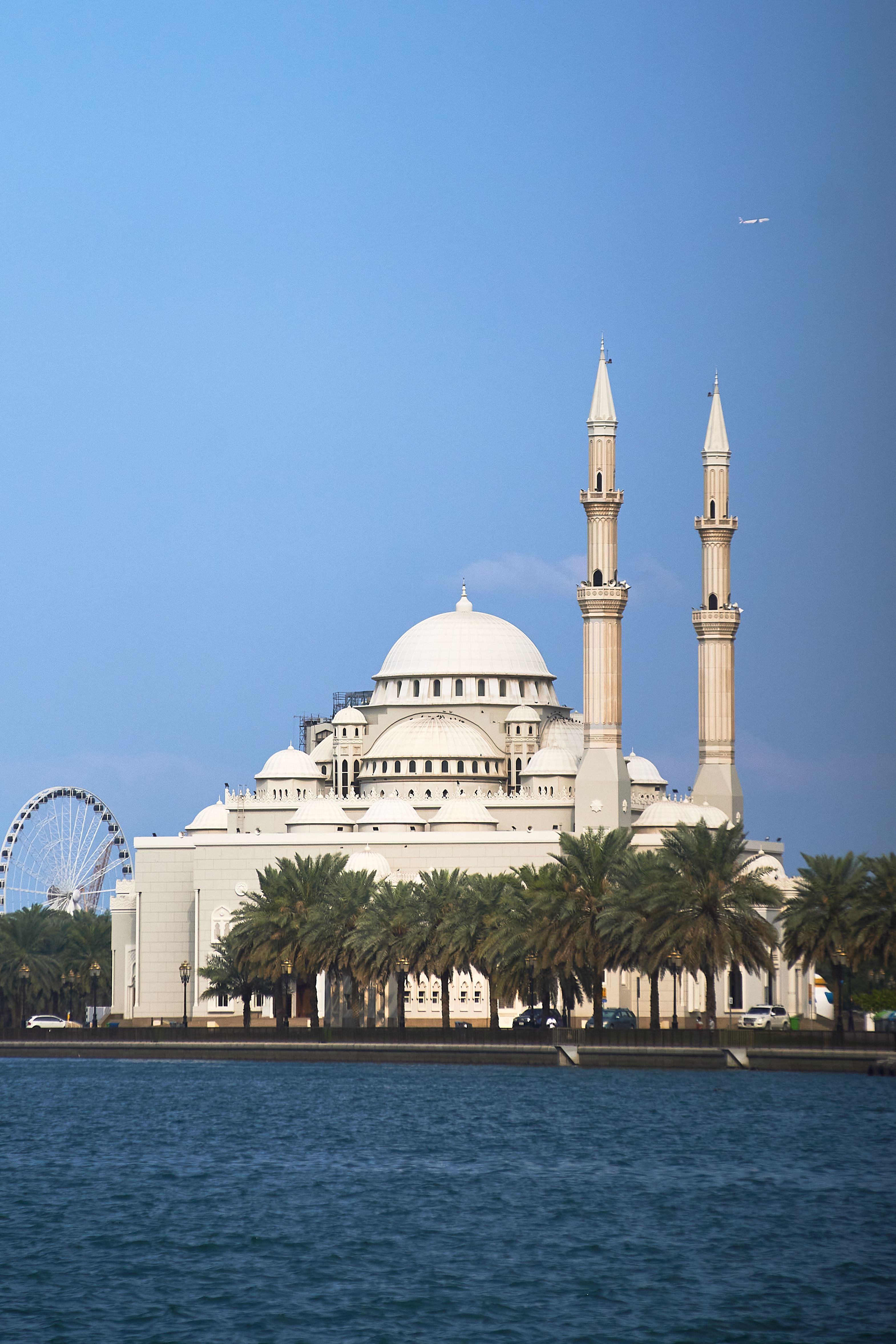 Stunning view of Al Noor Mosque by the water in Sharjah, UAE.