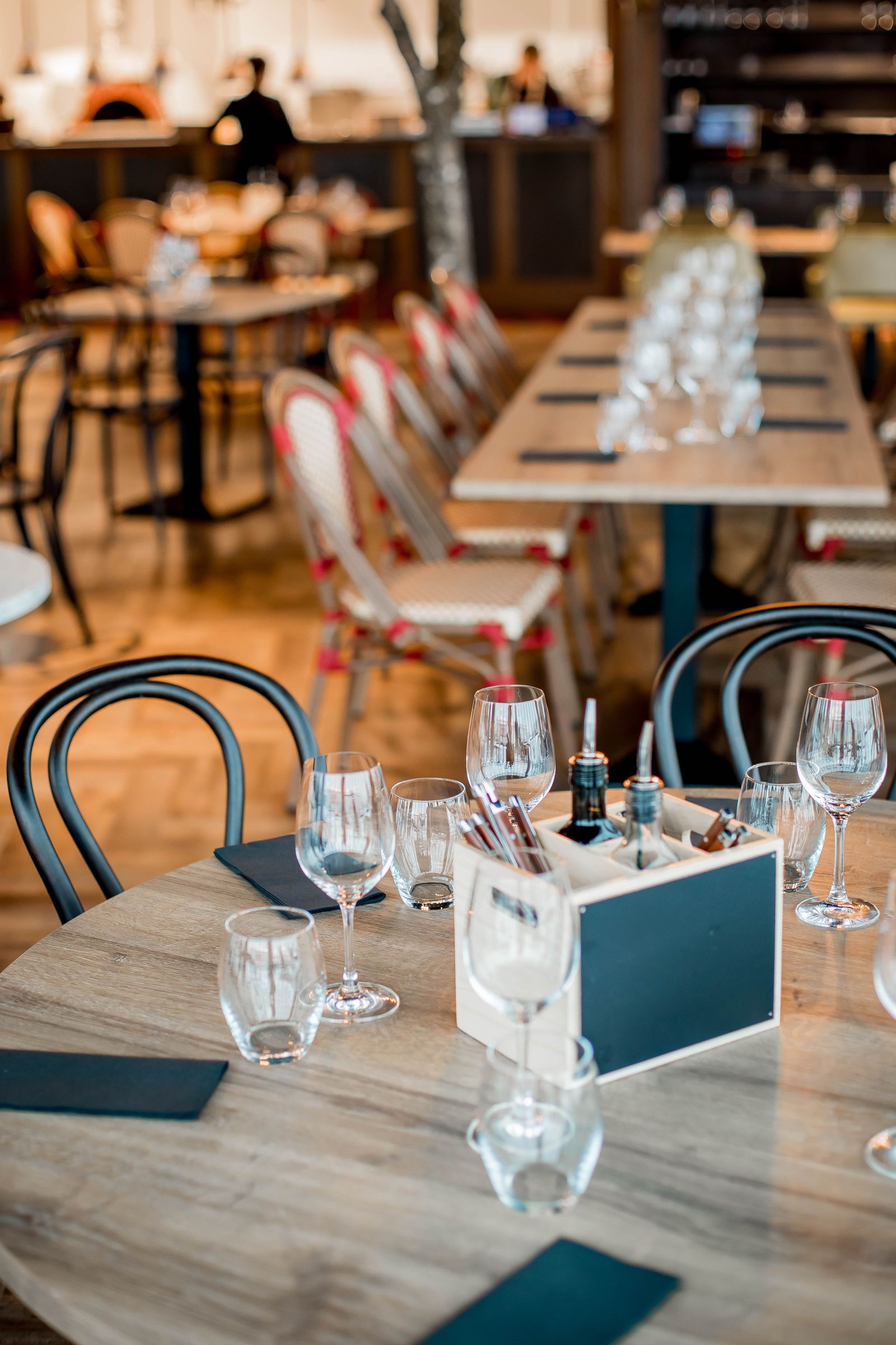 Empty restaurant tables ready for imaginary diners.