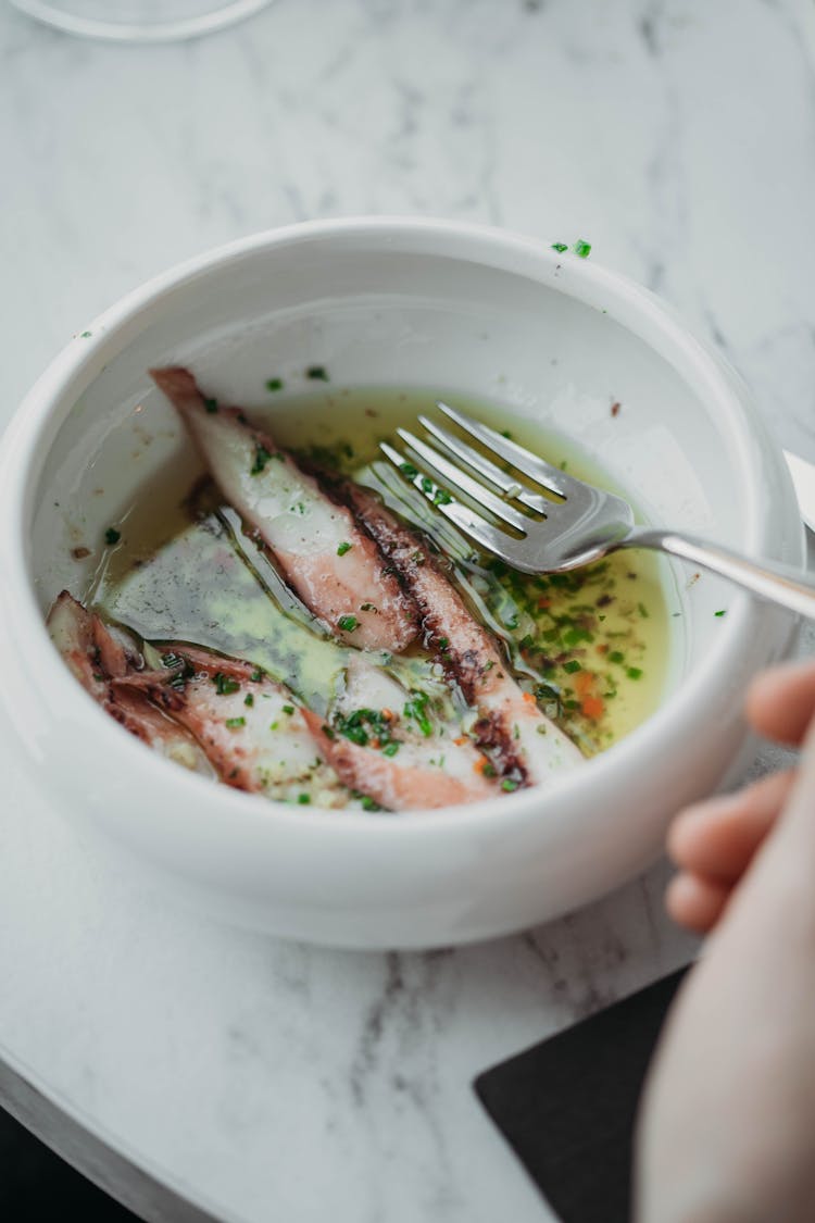 Small Bowl Of Delicious Fish Soup With Chunks Of Meat 