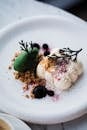 Nicely Decorated Ice Cream Dessert with Addition of Chocolate and Berry 