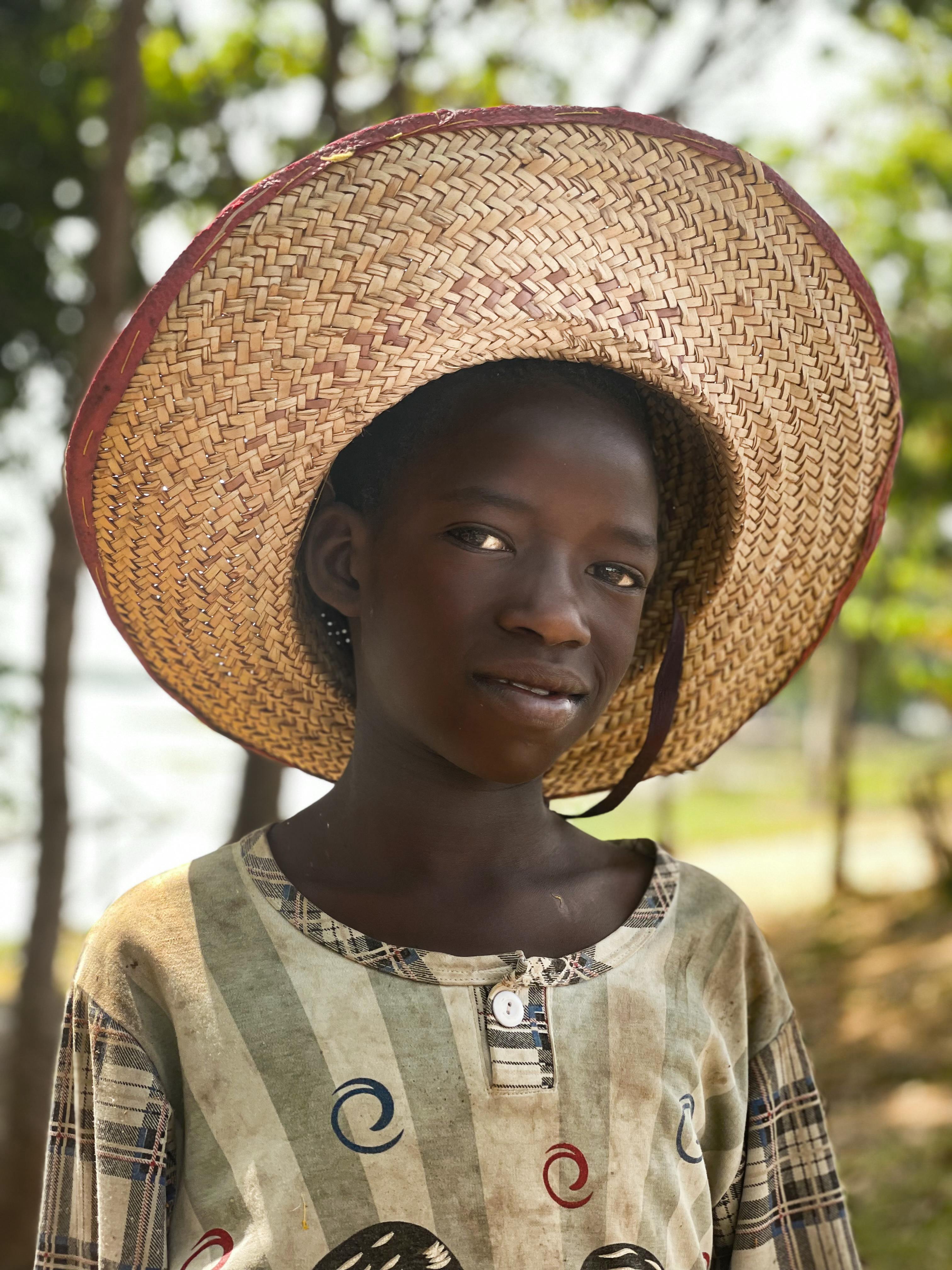 a girl wearing straw hat