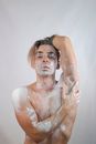 Portrait of Man Covered in White Powder 