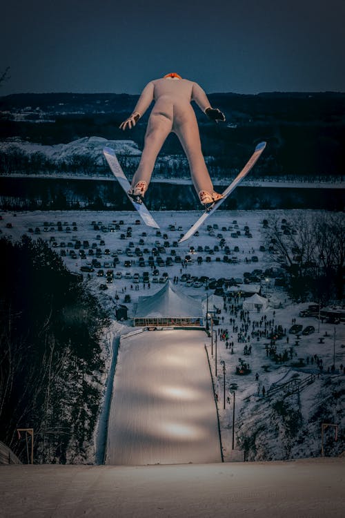 Free Ski Jumper During a Jump Stock Photo