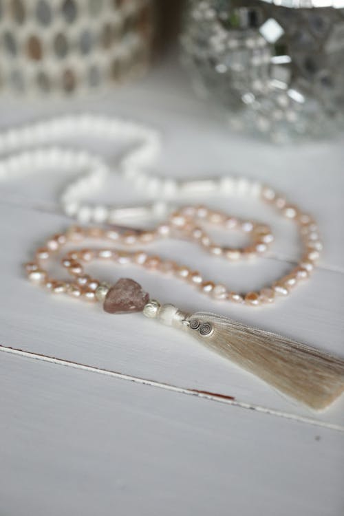 Close-up of Accessories on White Wooden Surface