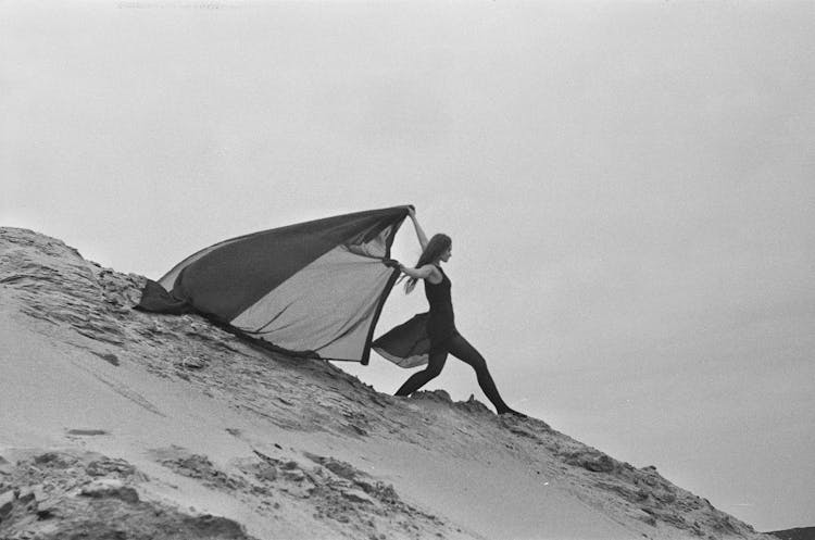 Woman Posing With Fabric On Slope