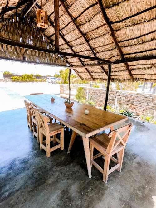 Free Dining Table and Chairs in a Nipa Hut Stock Photo