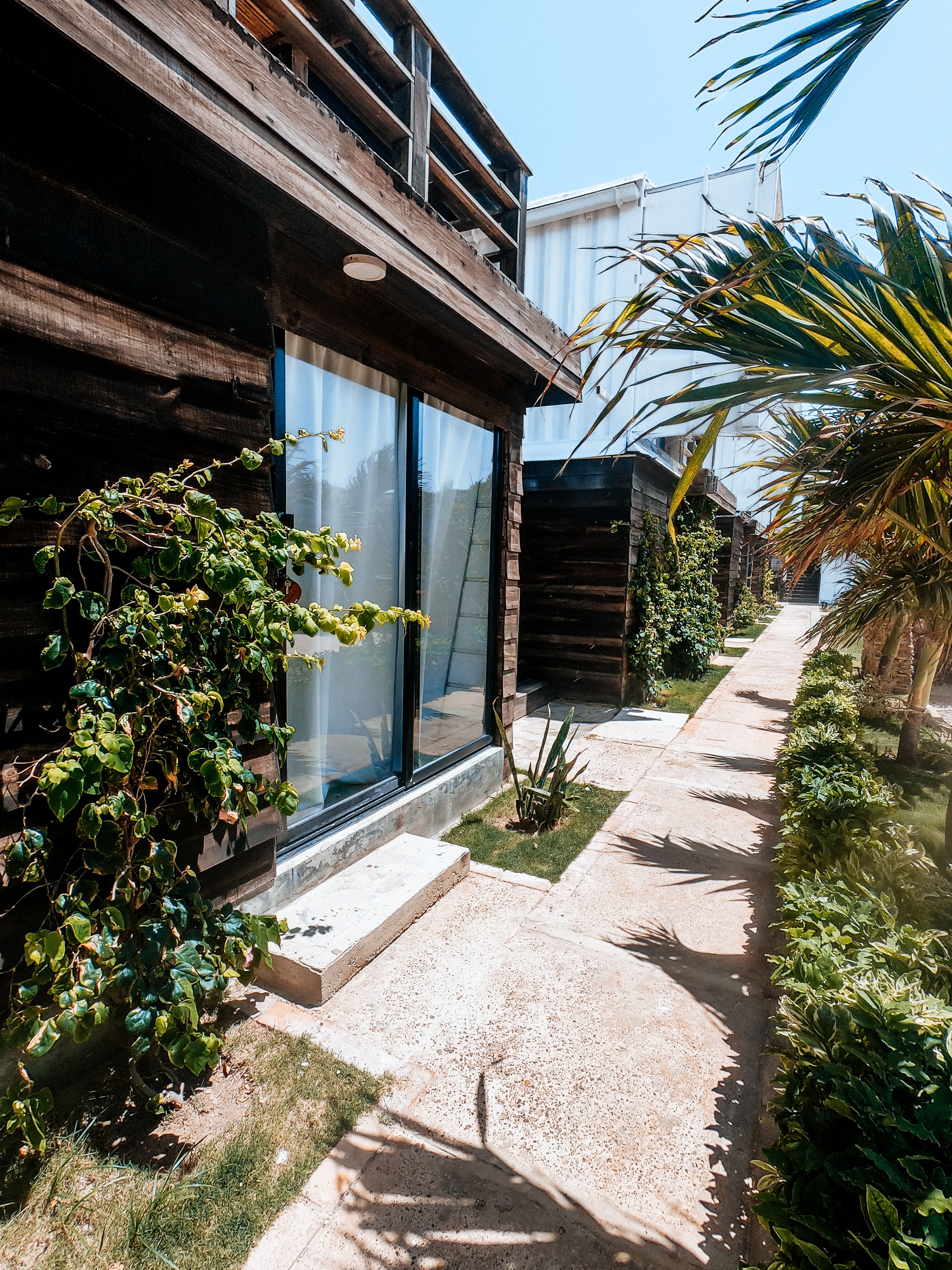A Wooden Pathway in a Resort going towards the Shore · Free Stock Photo
