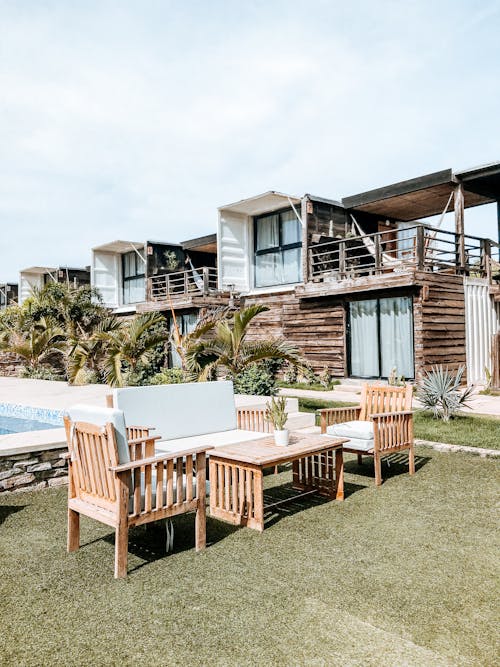 Brown Wooden Table and Chairs on Green Grass