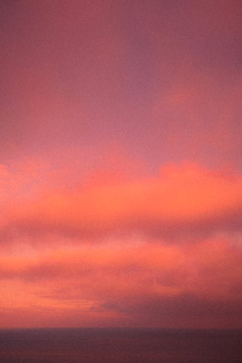 Pink and Orange Sky Above a Sea 