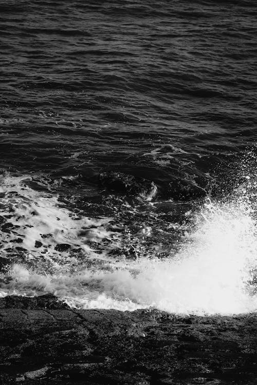 Free Close-up of Waves Breaking on a Rocky Coast  Stock Photo