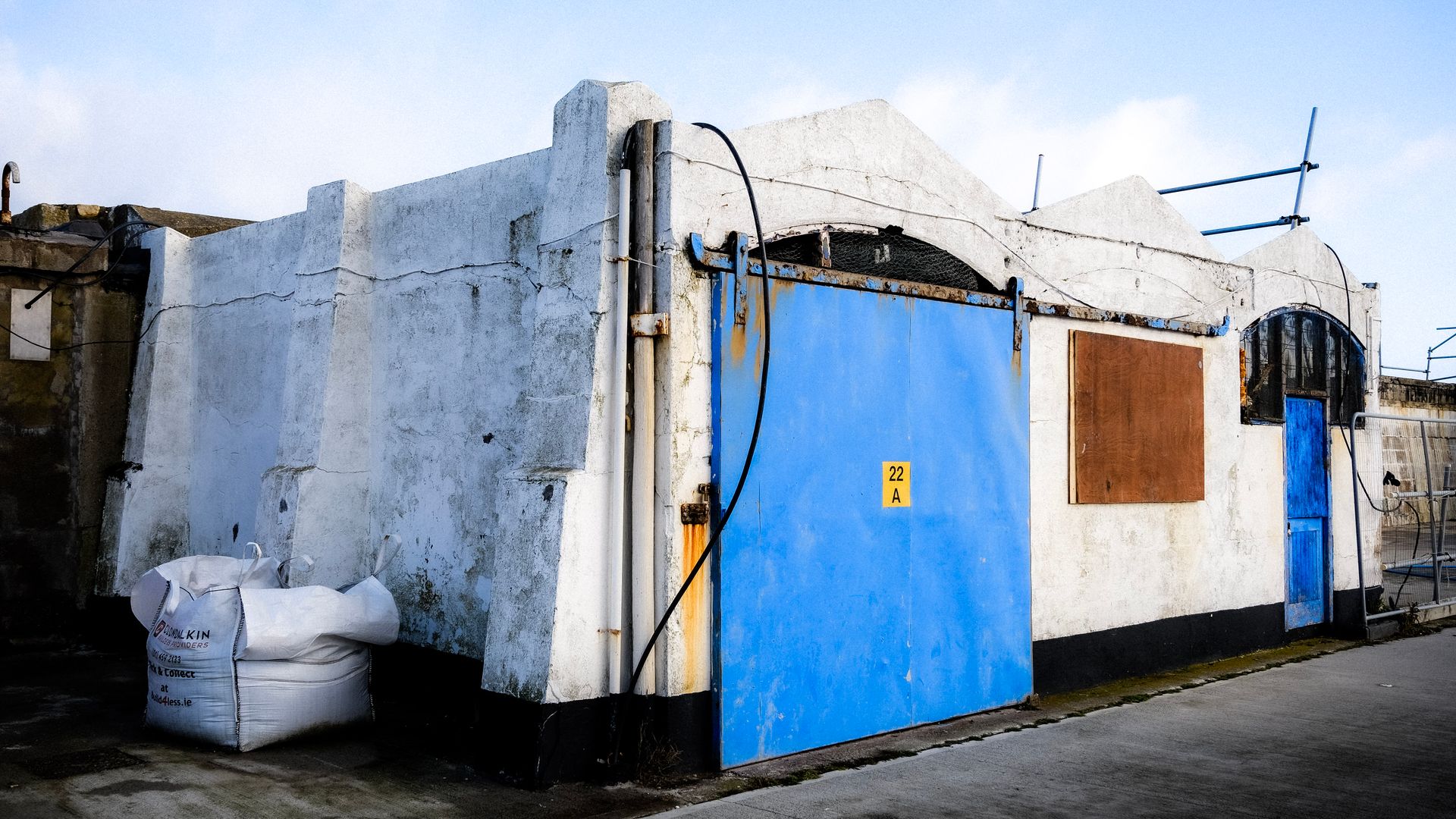 A Building with a Blue Sliding Door