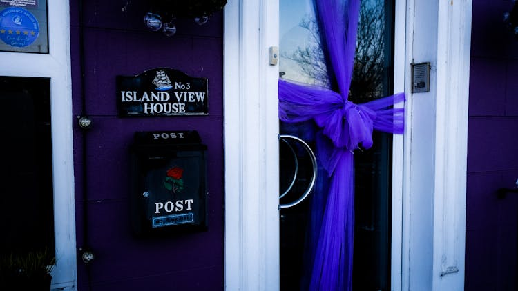 Purple Ribbon On Glass Door