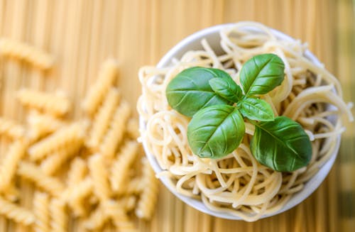 Free Pasta Noodles With Fresh Basil Leaves Stock Photo